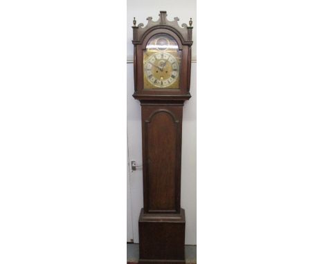 Thomas Quested Wye, circa 1780 - a George III break arch, oak, longcase clock, the brass dial having a silvered chapter ring,