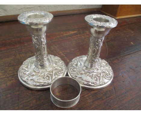 A pair of Victorian silver candlesticks, together with a silver napkin ring 