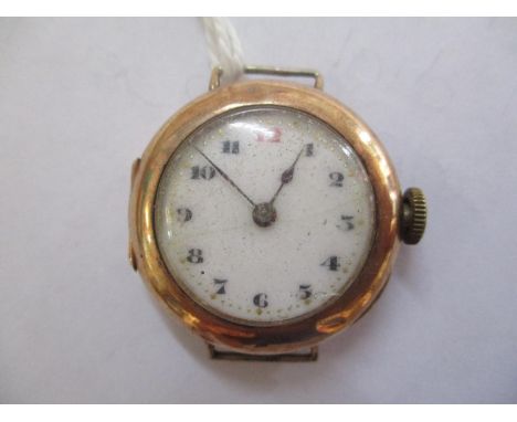 An early 20th century gents Rolex yellow metal wristwatch having a white enamel dial with Arabic numerals and fitted with a 1