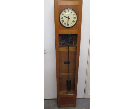 A Magneta 20th century electric slave clock in a light oak and glazed case having a white painted dial with Roman numerals, 5