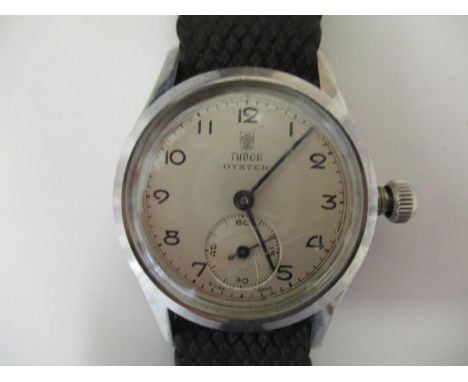 A gents vintage stainless steel cased Tudor Oyster wristwatch by Rolex with a 17 jewelled movement, having a silvered dial wi