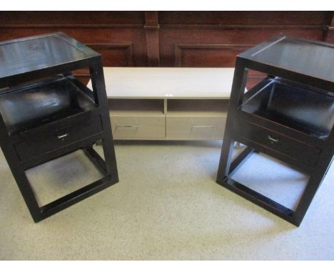 A pair of Italian black bedside tables with single drawer, together with a contemporary light wooden side unit on chrome feet
