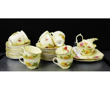 A Hammersley & Co rose patterned teaset, comprising twelve side plates, twelve saucers, twelve tea cups, two cake plates, a m