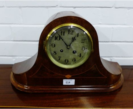 A mahogany and inlaid mantle clock the silvered dial with Arabic numerals, 45 x 25cm