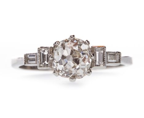 OLD CUT DIAMOND RING, the old cut diamond of approximately 1.20 carats, flanked by baguette cut diamonds on each shoulder tot