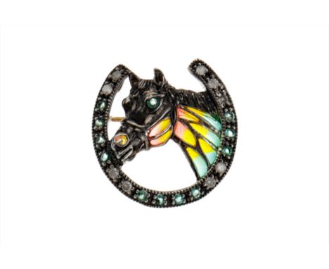 PLIQUE-A-JOUR HORSESHOE BROOCH, the horse head with emerald eye and red, yellow and green enamel decoration, within an emeral