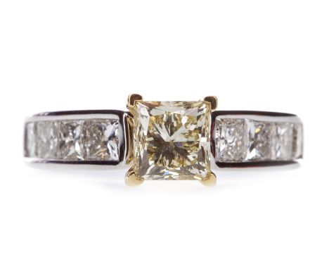 YELLOW DIAMOND RING, the yellow princess cut diamond of approximately 1.50 carats, flanked by four princess cut diamonds on e