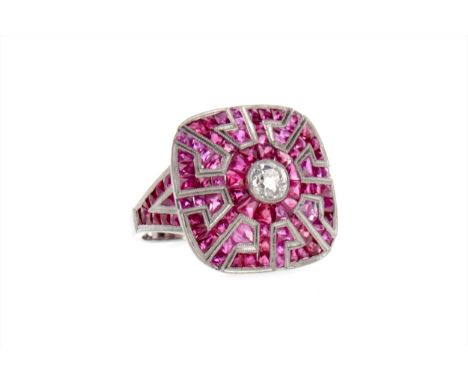 SPINEL, RUBY AND DIAMOND AZTEC RING, the central old cut diamond of approximately 0.45 carats, surrounded by rubies, unmarked