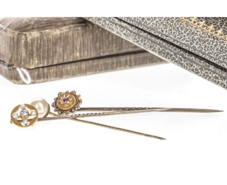 DIAMOND SET STICK PIN, with a central old cut diamond of approximately 0.05 carats flanked by four pearls, marked 15ct, along