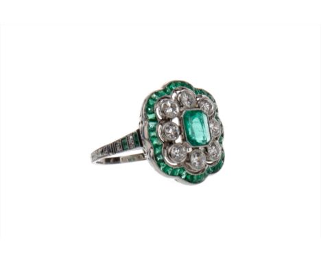 EMERALD AND DIAMOND RING, the central step cut emerald surrounded by diamonds totalling approximately 1.20 carats, in turn bo