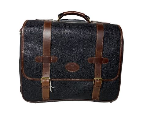 A mulberry travel case on wheels. scotch grain leather in (black or blue black), with brown straps and binding. checked linin