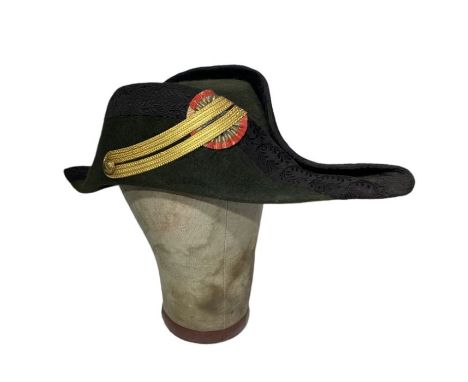 A 19th century, c1870s French Military Bicorn hat in bottle green with black silk brocade ribbon binding, gold braid and a ri