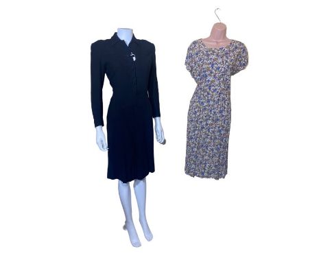 1940s and later clothing to include a black wool shirtwaist dress with heavily padded shoulders, a floppy rayon floral dress,