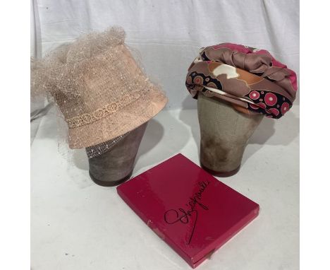 A 1960s turban made from a Christian Dior scarf, a 50s/60s bucket hat, a Schiaparelli stocking box with one pair of Schiapare