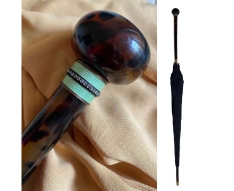 An elegant, Edwardian long handled umbrella or parasol by Thomas Brigg & Sons featuring a black, hand stitched silk canopy ov
