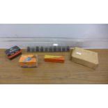 11 assorted router bits, a 3" hand vice, a rawl plug ½" chuck and a Golden Goose JT-6 chuck and a