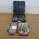 A 50 piece twist drill set plus a 6 piece step drill set, unused