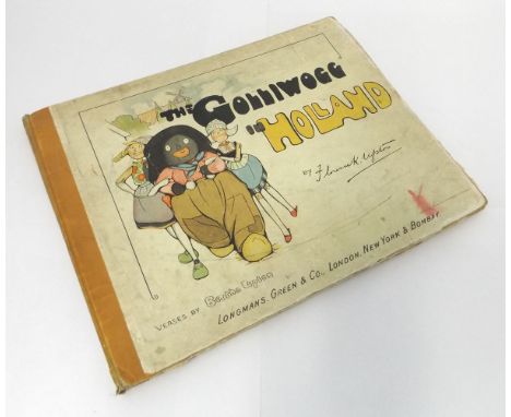 FLORENCE K UPTON: THE GOLLIWOGG IN HOLLAND, [1904], oblong original cloth backed pictorial boards worn, inner joints split, c