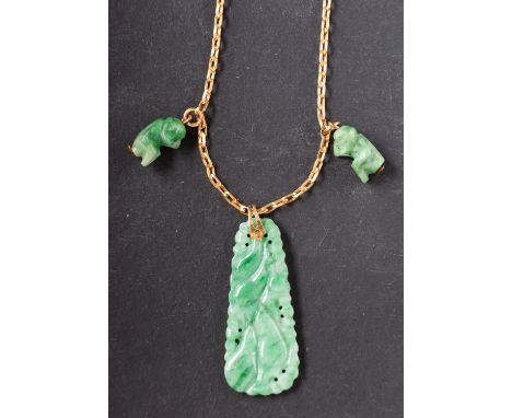 A jade pendant, carved in the form of a bunch of gourds, with two charms in the form of monkeys, together with a 9ct gold, be