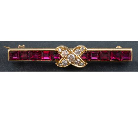 A calibre-cut ruby and round, brilliant-cut diamond bar brooch, total estimated diamond weight ca. 0.20ct, total length ca. 4