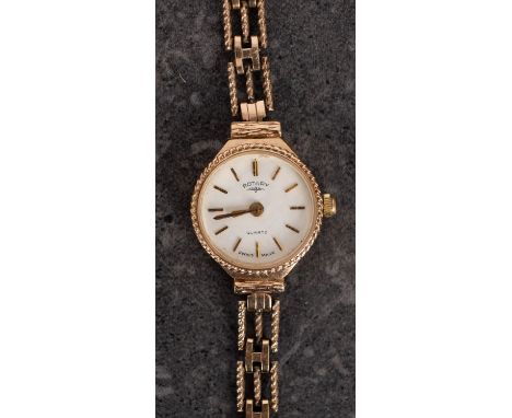 Rotary a lady's  wristwatch the white dial with raised gold baton numerals and hands and signed Rotary Quartz, the case stamp