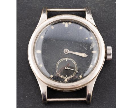 A military brass plated wristwatch the black dial with luminous dot hour markings, luminous hour hand, the minute hand missin
