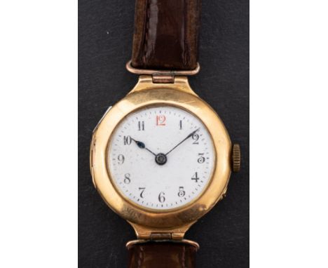 A 18ct gold lady's  wristwatch the white enamel dial with Arabic numerals and blued steel spade hands, the movement stamped S