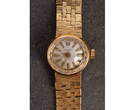 Tissot a lady's  cocktail watch the dial with raised baton numerals and signed Tissot, the case stamped 18K, 0.750, CHs. Tiss