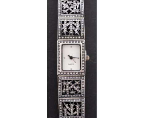 Barruci, a Faberge style wristwatch, with inset paste to the white-metal case and matching gate-bracelet, diameter 14mm, purc