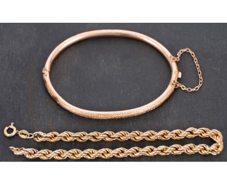 A 9ct gold ropetwist bracelet and a bangle, the bangle stamped '9CT', length of bracelet ca. 21cm, inner diameter of bangle c