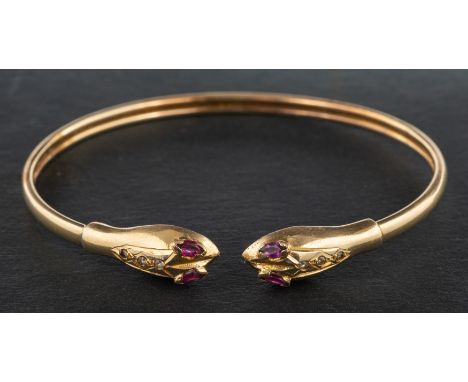 A ruby and white paste, double-headed snake bangle, stamped '585', inner diameter ca. 6.2cm, total weight ca. 8.6gms.