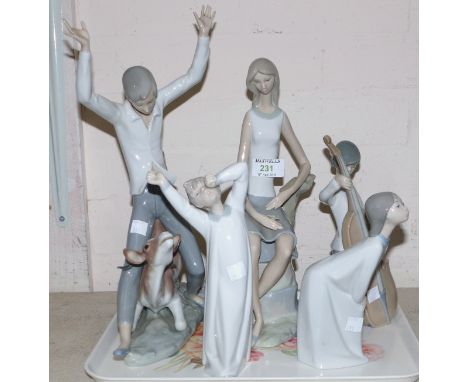 Three Lladro figures, Boy and Girl in night shirts, boy playing double base; A Lladro figure of a seated girl with flower; A 
