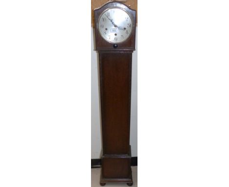 An oak granddaughter clock with chime; a carved oak firescreen