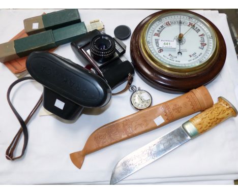 An Edwardian barometer; a Praktica camera; a slide rule; a fishing knife; a stopwatch