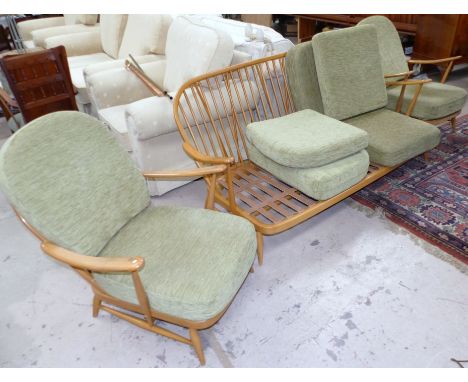 An Ercol lightwood 3 piece stick back lounge suite comprising 3 seater settee and 2 armchairs, with light green dralon cushio