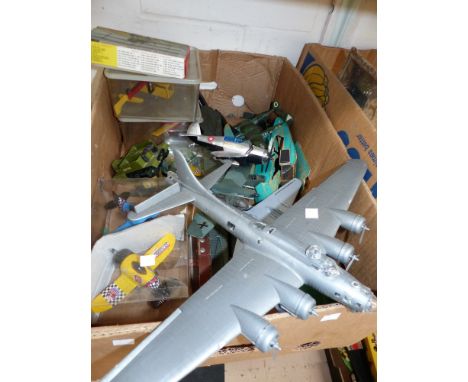 A selection of die cast vehicles and vintage games