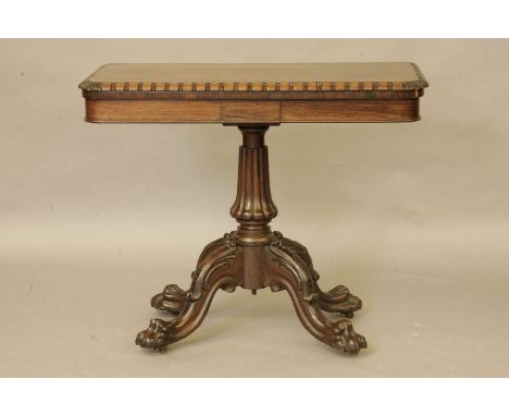 A George III rosewood fold over card table, probably Irish, the rectangular top with dental moulding over a plain frieze, on 