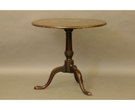 A George III Cuban mahogany tripod table, the circular top on turned column and out swept feet, together with a Victorian wal