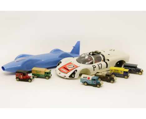 'Donald Campbell's Bluebird',  blue celluloid model with inscription to base promoting BP fuel, together with a model racing 