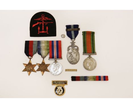 A group of WWII medals, presented to JP Anderson, D/MX103723, together with an HMS Implacable badge, a Freemason's hospital m