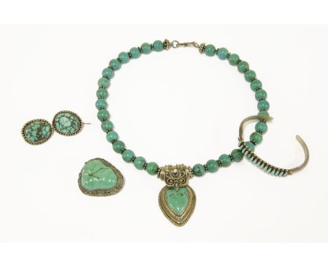 A silver turquoise cuff bangle, marked Paloma, a Mexican single row dyed turquoise necklace with turquoise centrepiece, a Chi