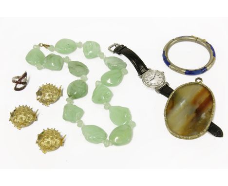 A large quantity of costume jewellery to include a large agate pendant, a silver and lapis lazuli bangle (damaged), a series 