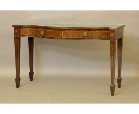 An Edwardian satinwood inlaid mahogany serpentine front buffet, the shaped top with with a quarter inlaid border, over two fr