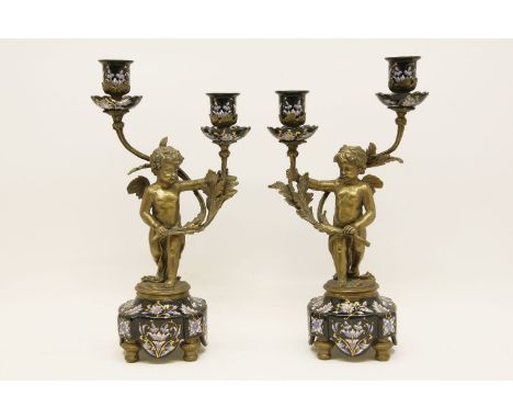 A pair of Louis XVI design gilt metal twin branch candelabra, on putti supports and porcelain bases (two sconces af), 38cm hi