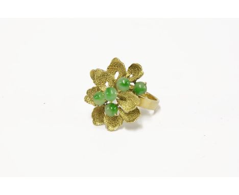 A gold jade cabochon floral spray ring, marked 14k (tested as approximately 14ct)7.40g size M½