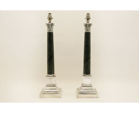 A pair of silver plated and marble Corinthian column form lamp bases, 59cm high