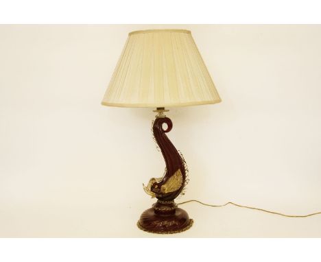A ruby glass and aventurine dolphin lamp base, 68cm high