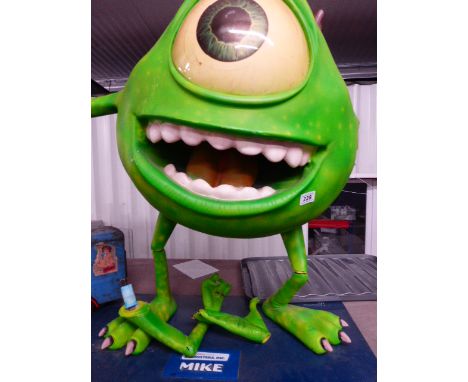 A freestanding Disney Pixar Monsters Inc Mike Wazowski figure on stand, formerly used for cinema display, approx 31" high