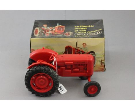 Boxed Pippen Toys The Nuffield Tractor in orange, fair to gd condition although missing funnel