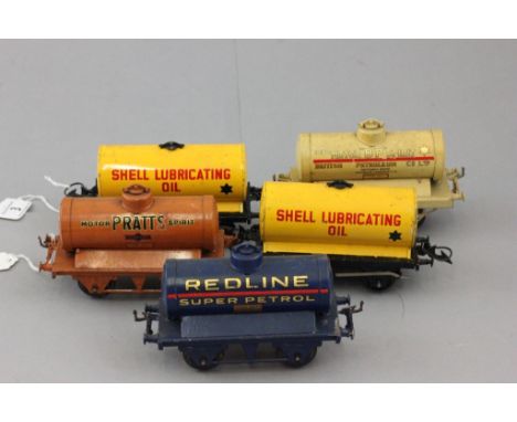 Five Hornby O gauge oil wagons to include Shell Lubrucating Oil x 2, Pratts Motor Spirit, Redline Super Petrol and BT Motor S